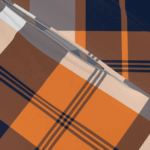 Gin Tonic 3-piece flannel bedding set with soft orange and navy plaid design for cozy comfort. - Image 2
